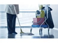 staff with mop and cleaning cart