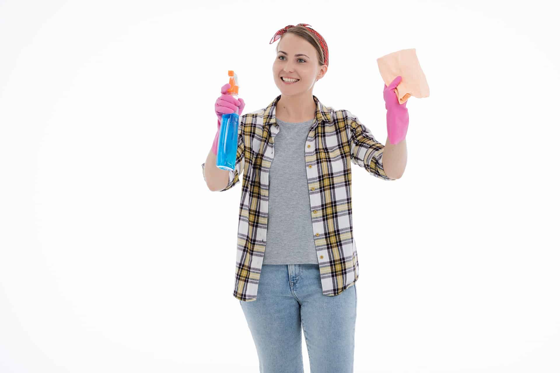 Woman hold spray bottle and cloth