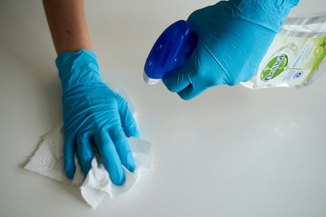 a professional cleaner with protective gear 