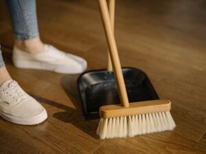 Sweeping with broom and dustpan