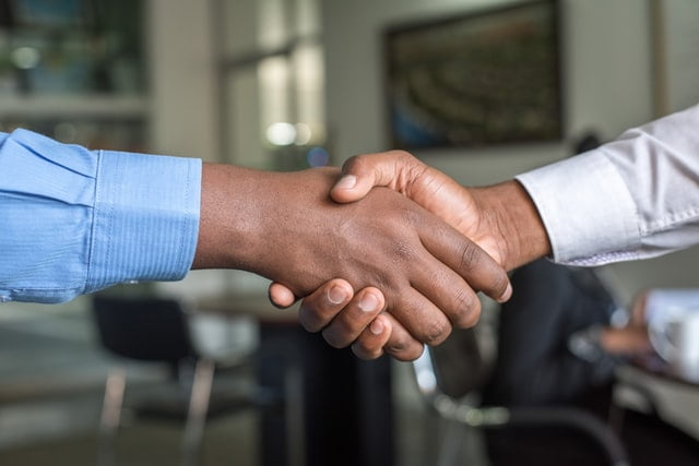 Two people making a deal about maintaining a post rental property clean.