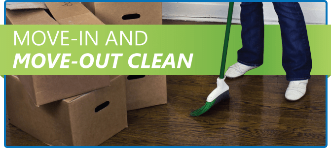 Woman sweeping floor with broom near moving boxes