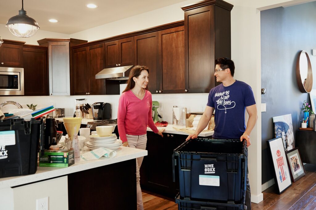 A man helping someone with a hoarding disorder move 