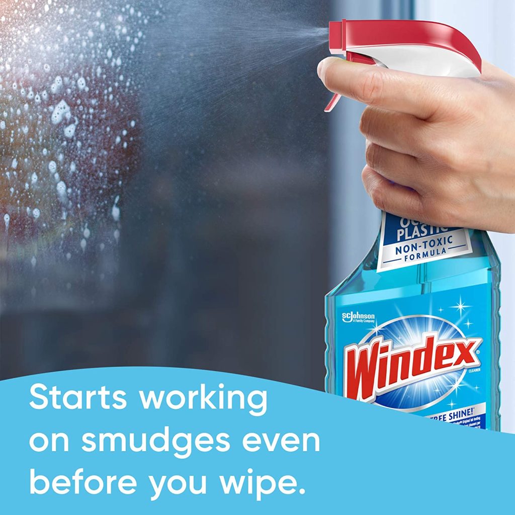 Spraying glass with Windex