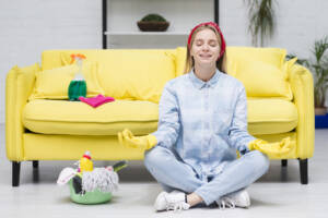 woman-with-cleaning-gloves-doing-yoga.jpg 
